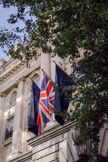 Union Jack and Rosewood London flags outside the elegant London hotel, a setting for a luxury UK wedding